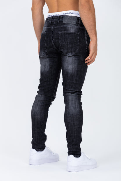 Jean coupe skinny noir peinture