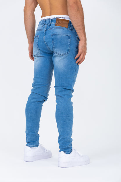 Jean coupe skinny bleu usé